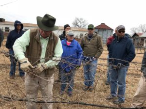 Johnston County Master Gardener Volunteers and others learning the proper way to prune a grape vine
