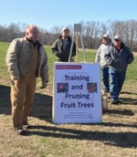 sign of training and pruning fruit trees at class outside